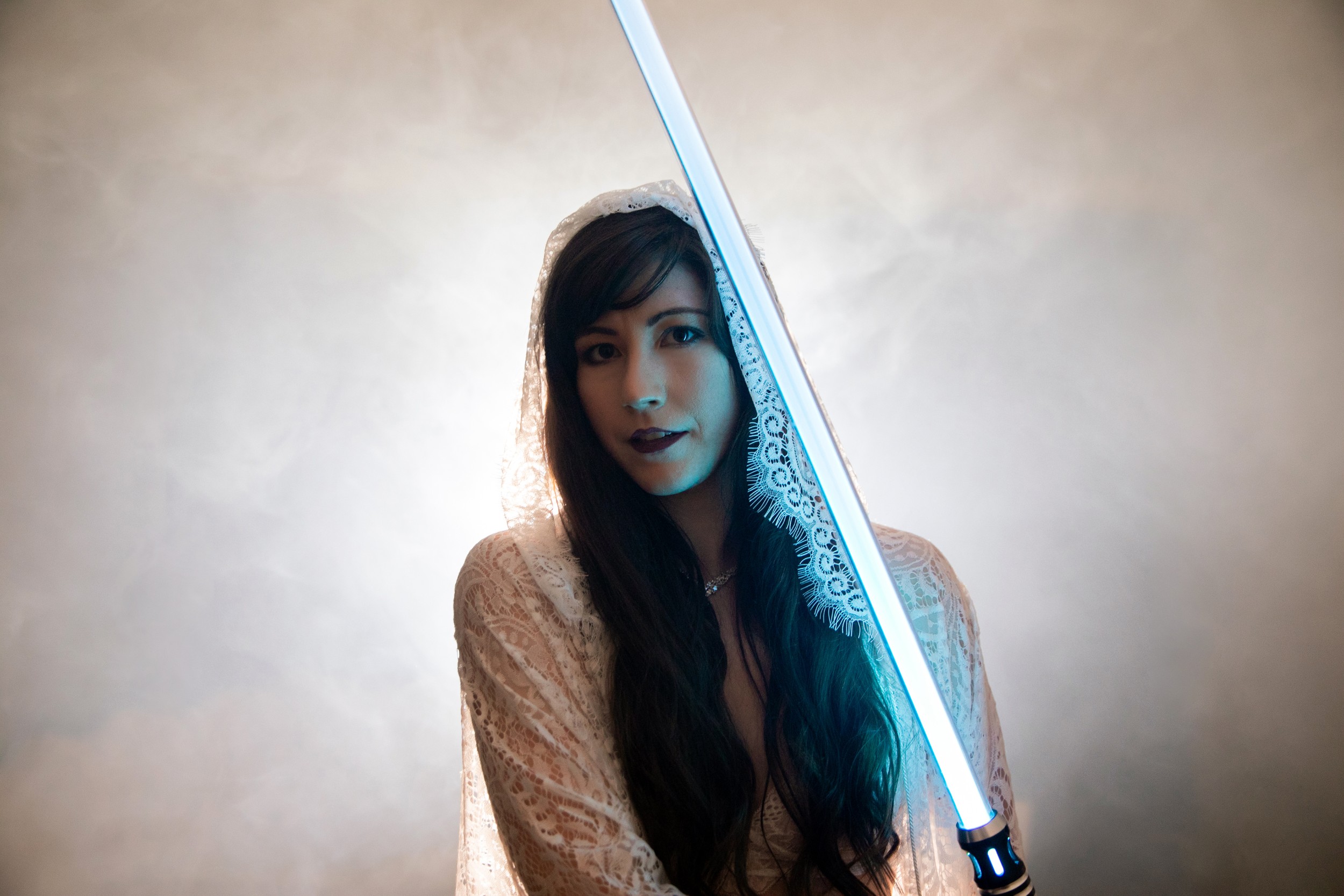 portrait of a woman with light saber