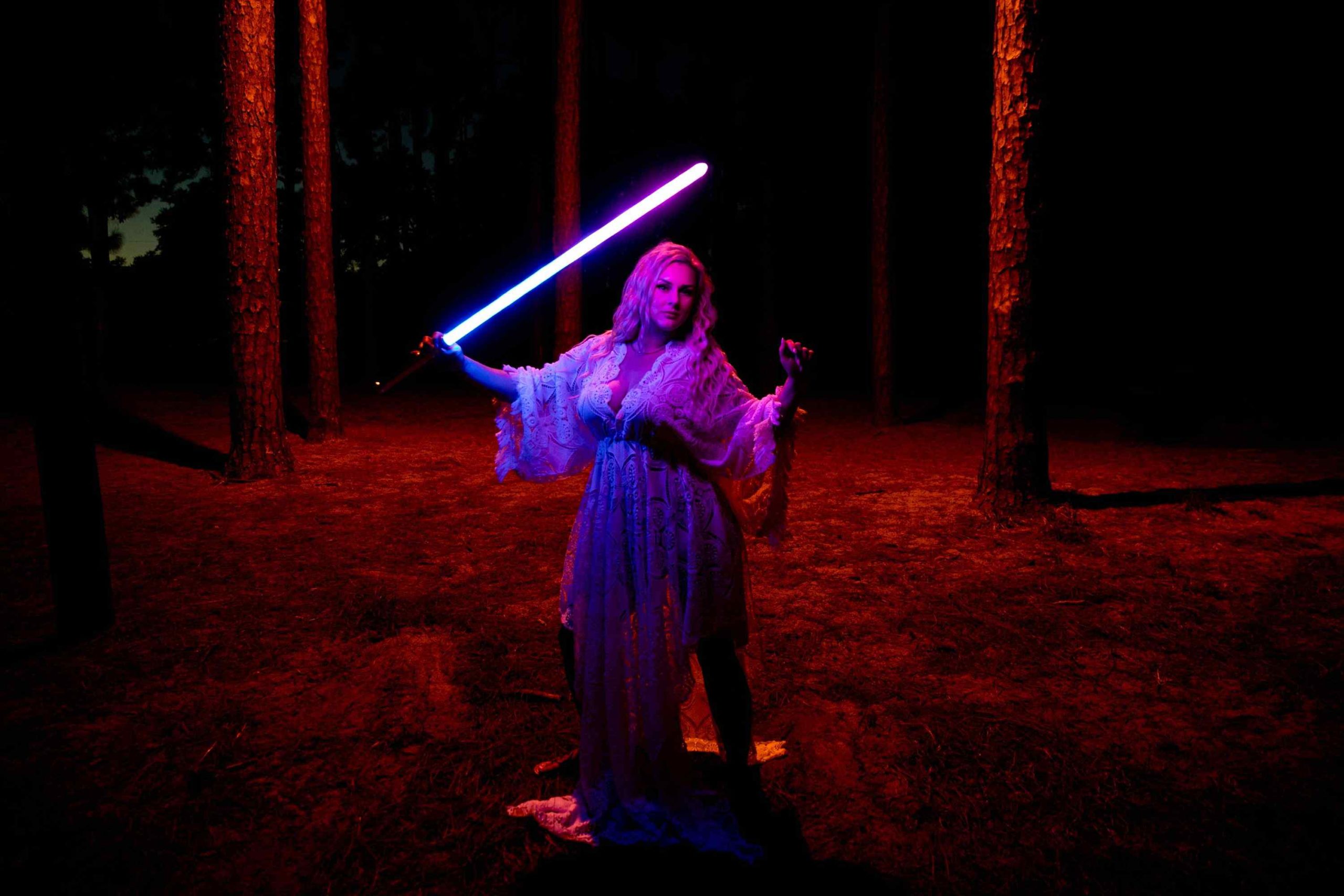 Portrait with lightsaber outside in the dark