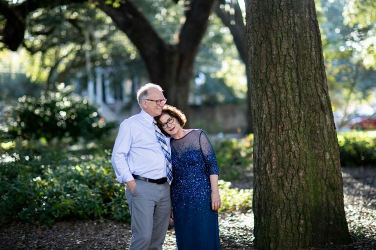 An older couple posing for a photo in charleston, south carolina.