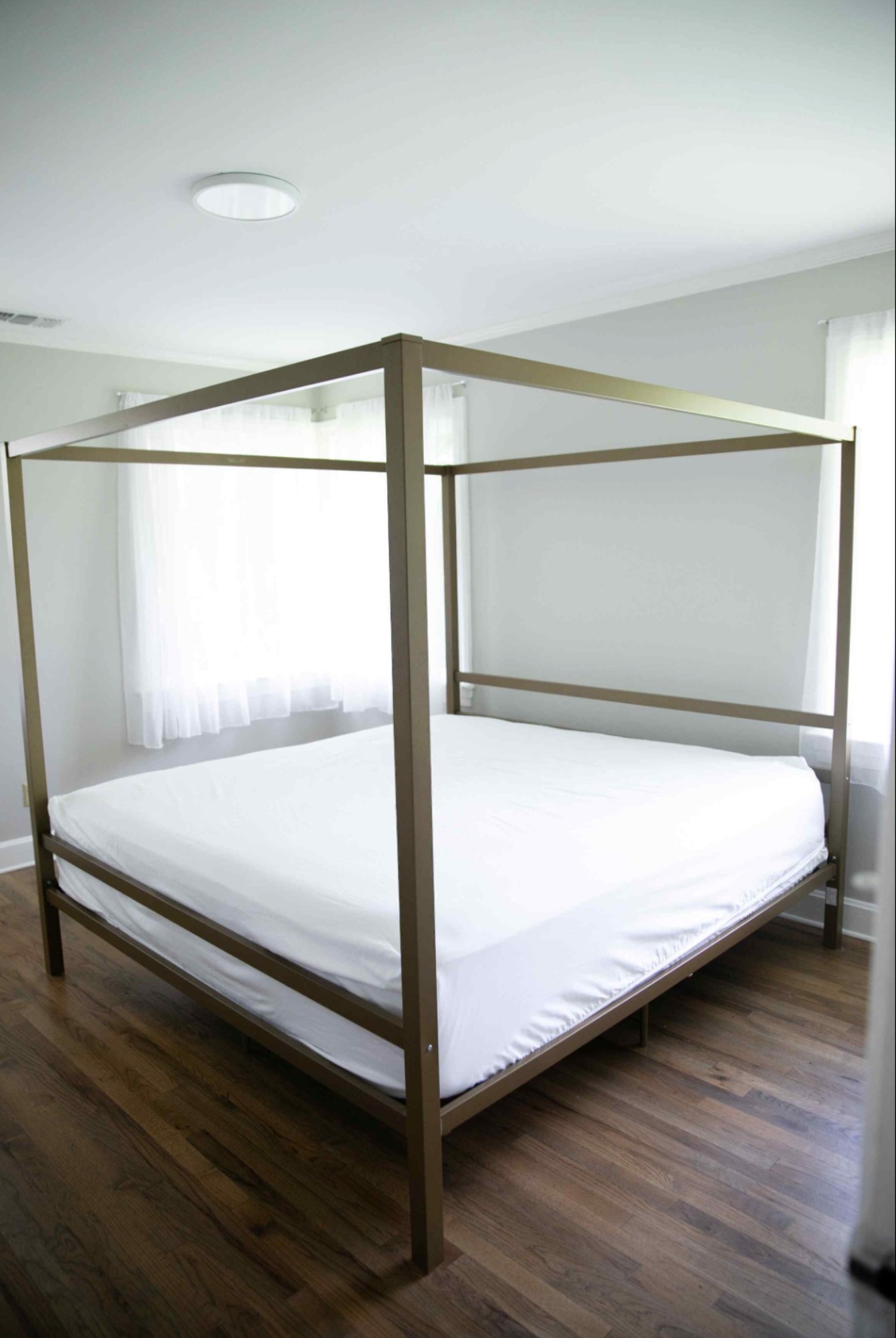 a gold canopy bed frame