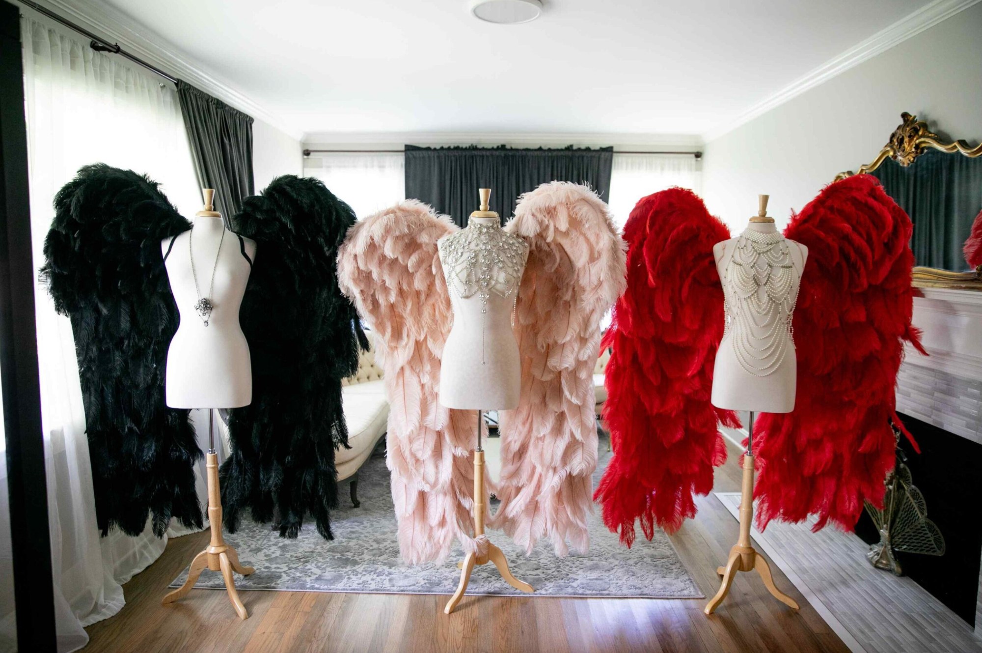3 pairs of angel wings on mannequins