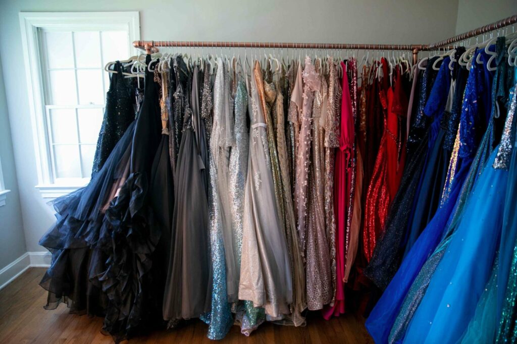 glamorous gowns hanging on a rack